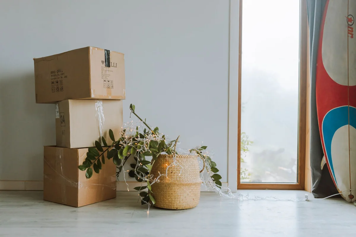 Moving boxes in an empty room, the seller timeline behind how fast you can close on a cash home sale in Iowa