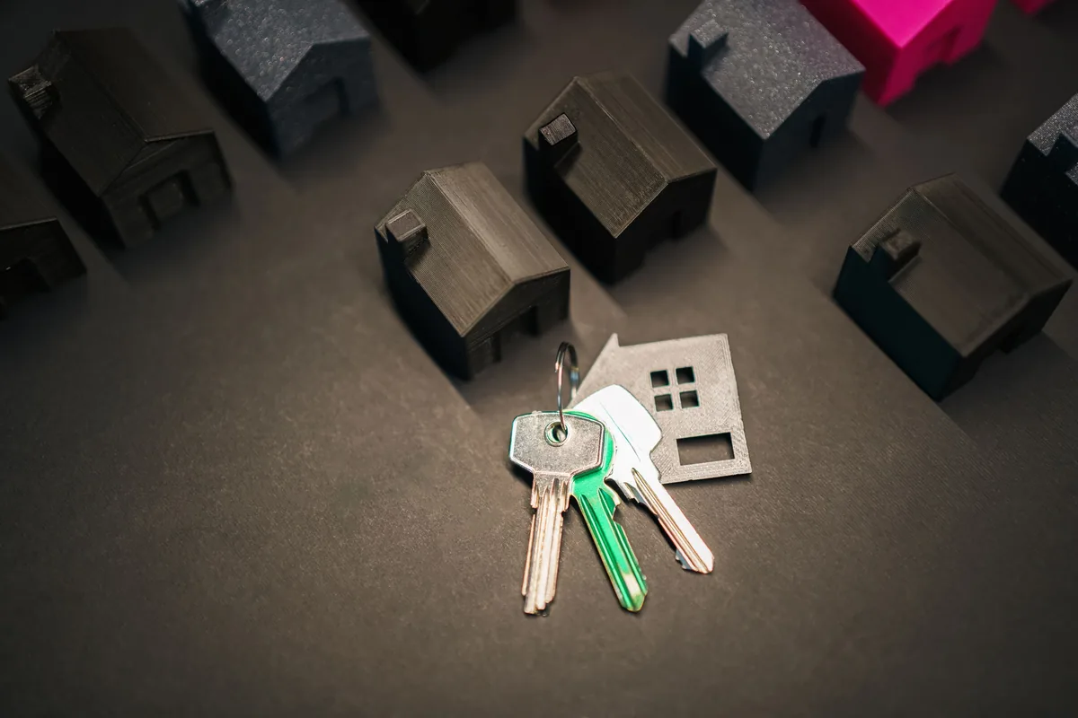 House keys on a table, deciding how much you lose selling a house as-is