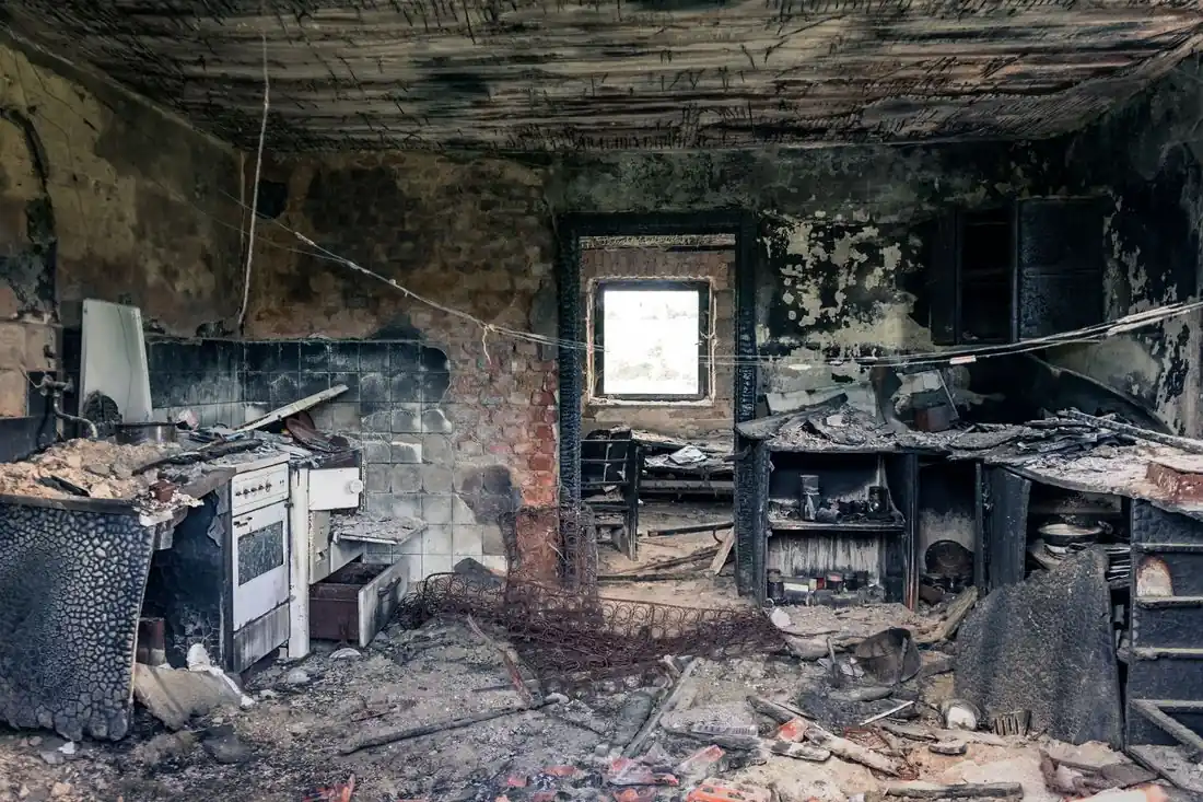 The burned interior of a fire-damaged house before it is sold as-is