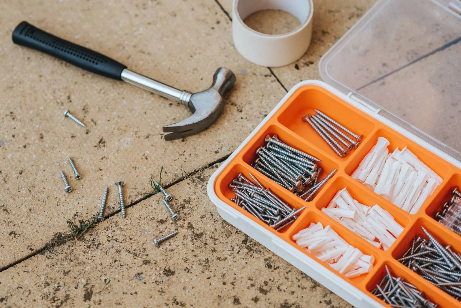 Repair tools laid out, representing fixes a seller can skip when selling as is