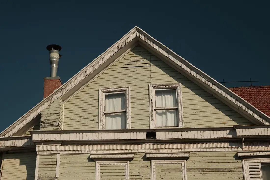 An older Iowa house exterior that a homeowner wants to sell as is