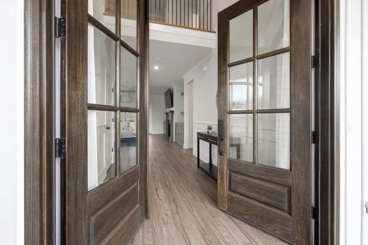 An open front door of a bright, empty house, representing the freedom to sell after a Chapter 7 discharge or the trustee abandons the property