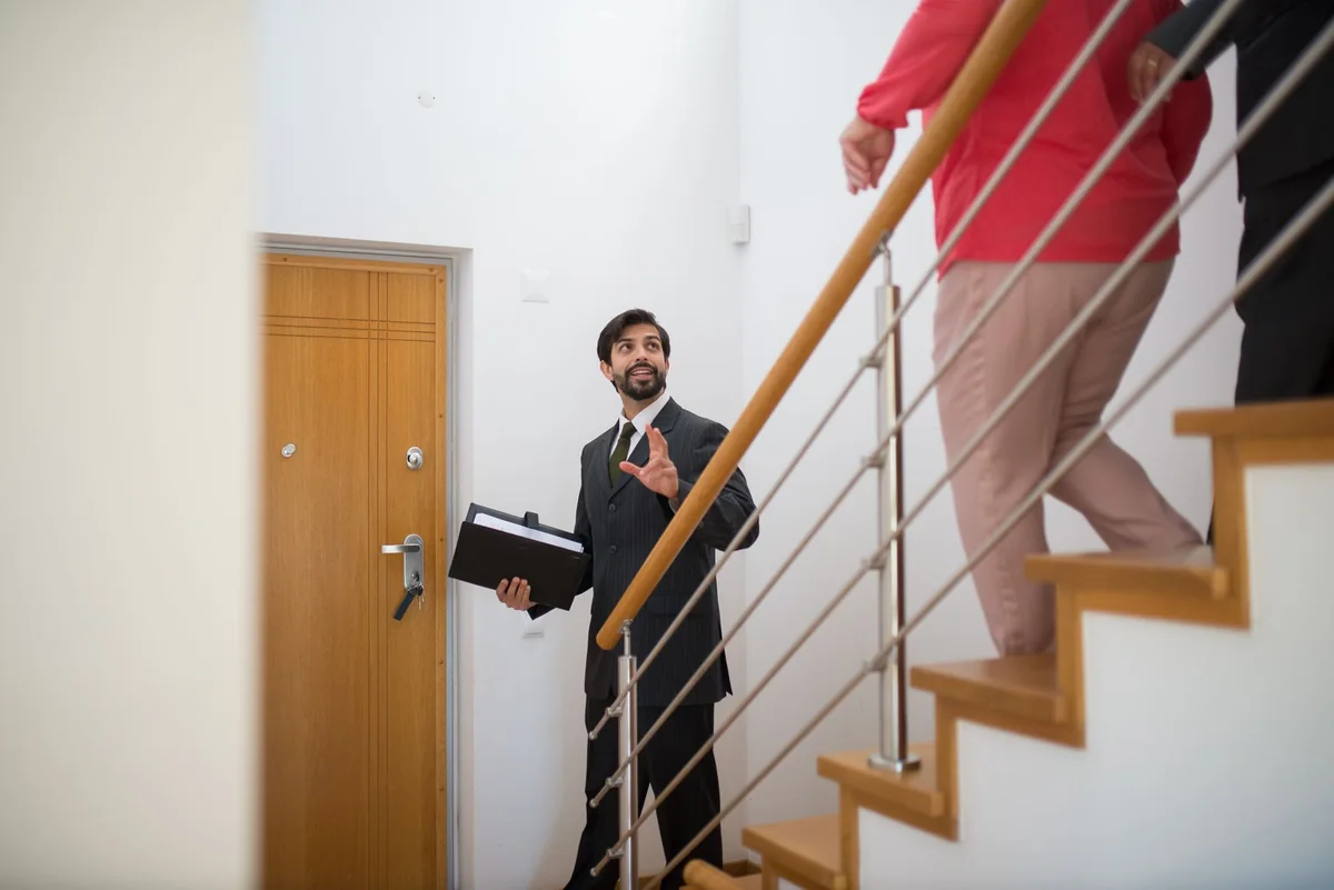 A homeowner weighing the pros and cons of a cash offer with an advisor