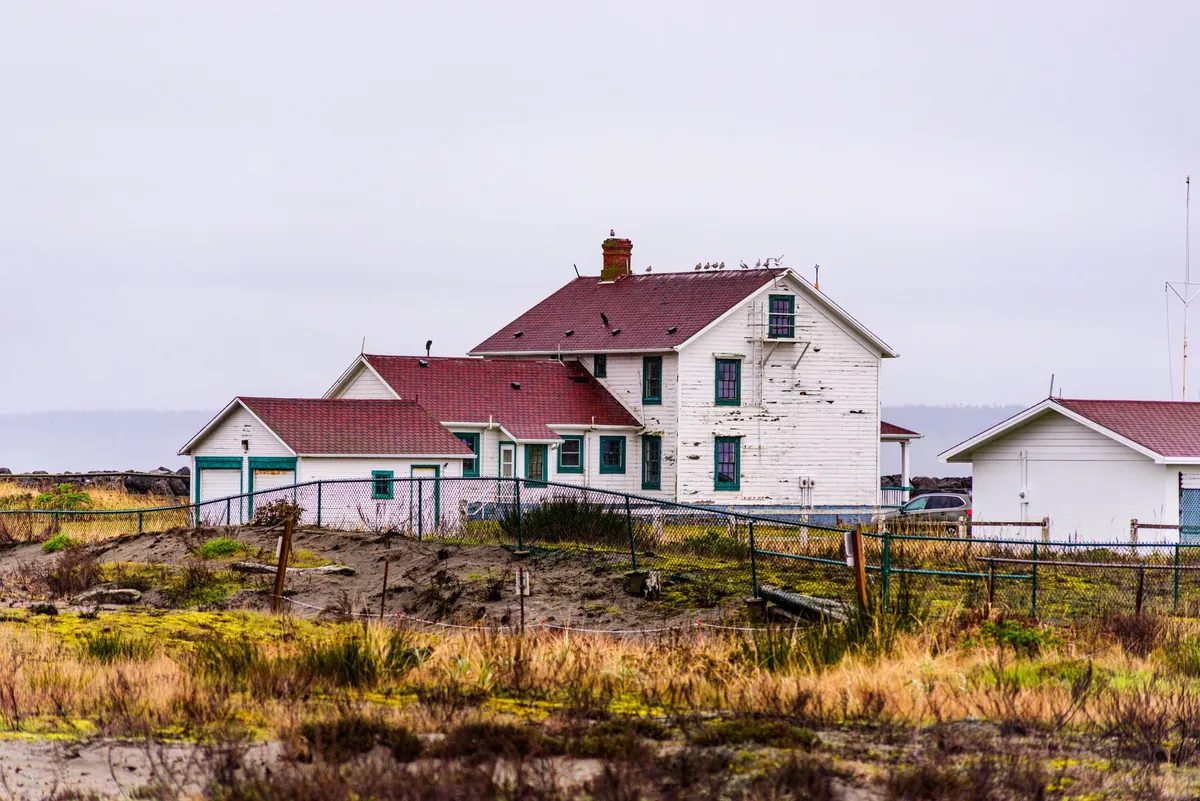 A white farmhouse in rural Iowa, the kind often sold on a contract for deed