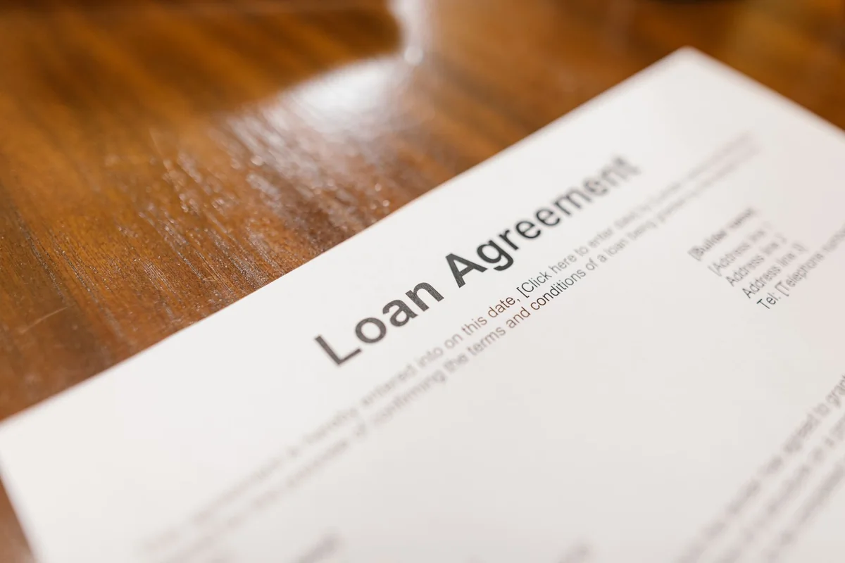 Mortgage paperwork on a desk, where a repair-heavy house loses financed buyers