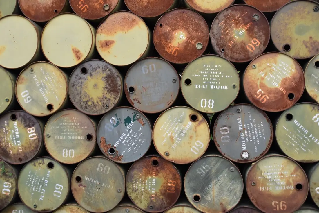 Old rusting steel fuel tanks, the kind of buried heating-oil tank a homeowner deals with when selling a house with an underground oil tank in Iowa