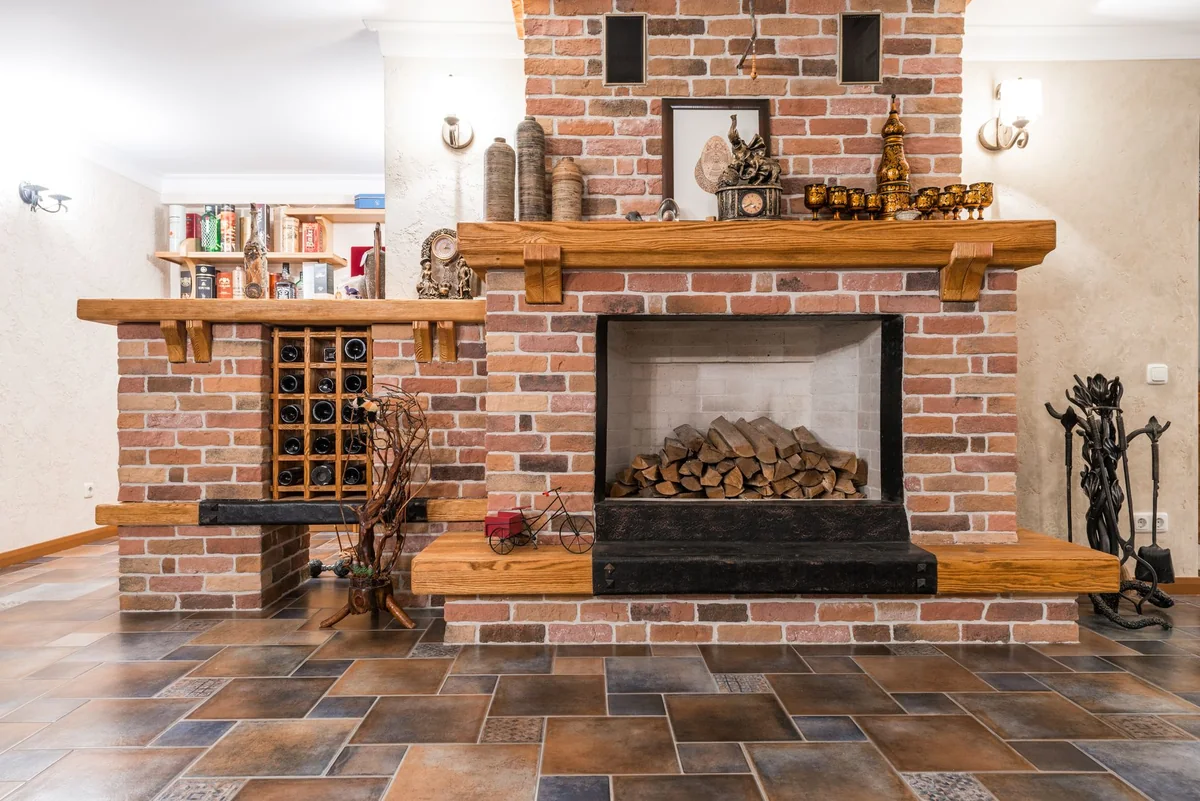 An interior brick fireplace with a wood stack, the appliance a bad chimney is supposed to vent safely