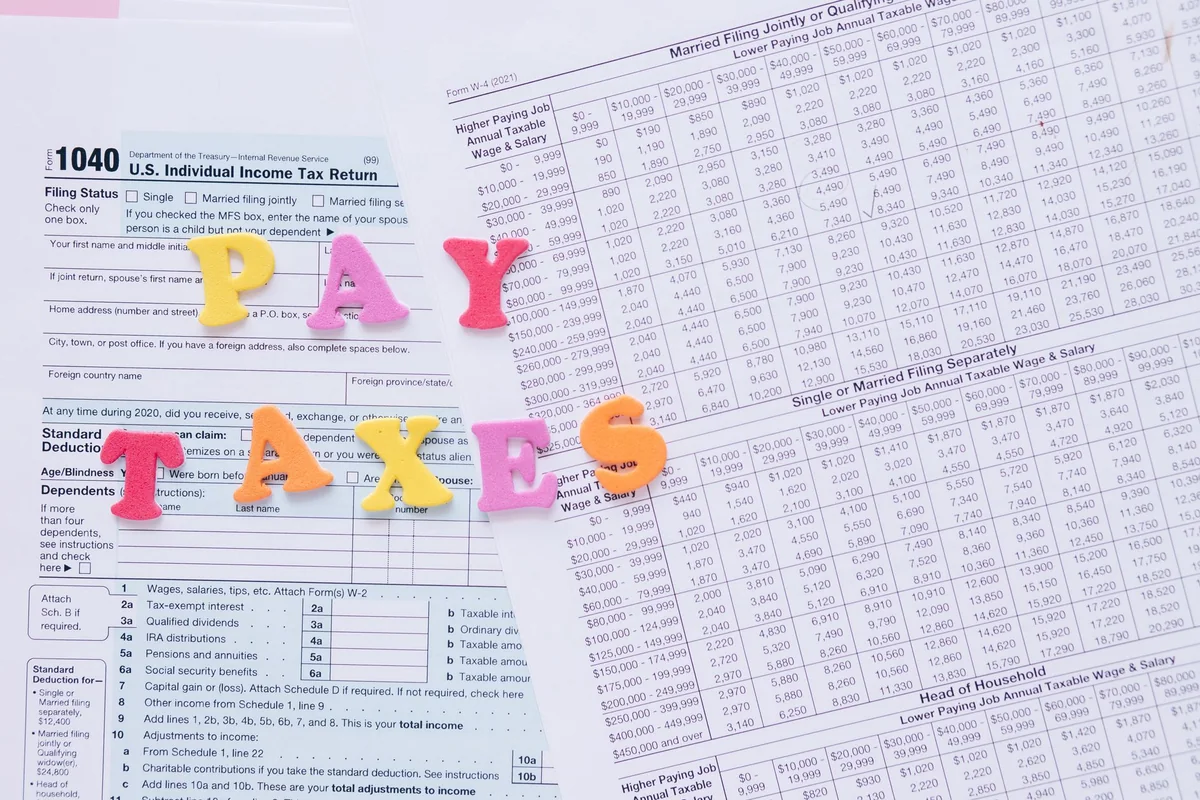 IRS tax notice paperwork on a table representing a Notice of Federal Tax Lien on a house