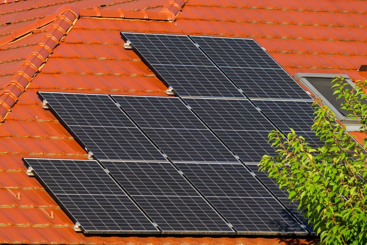 Close-up of solar panels installed on a house roof, showing what you actually own when selling a house with leased solar panels in Iowa