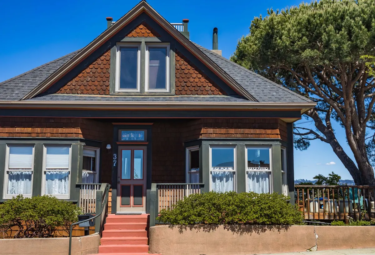 An older home with a front porch, the kind of Iowa house a remainderman inherits when a life estate ends