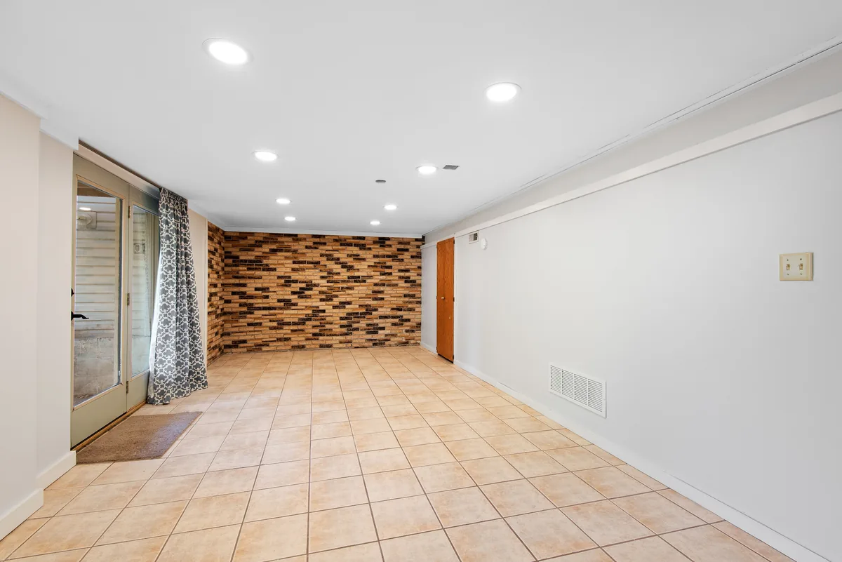 An empty room being checked for mold and moisture before selling