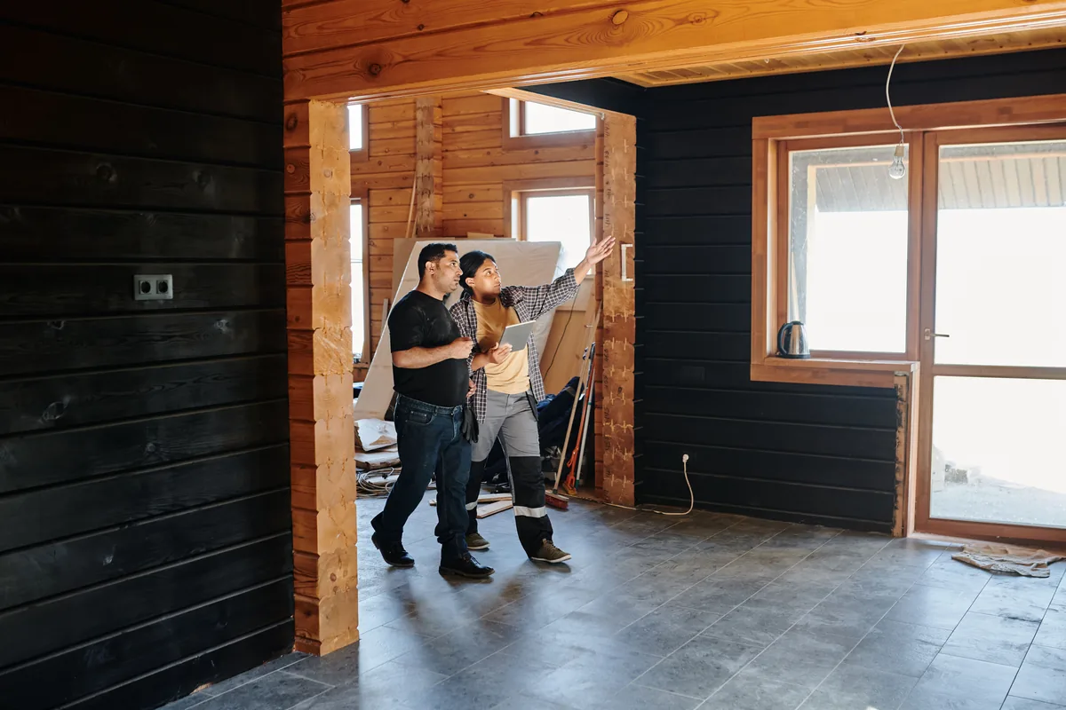 Contractors assessing mold remediation work before a home sale