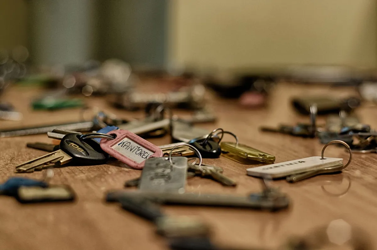 House keys handed over at closing after selling a house with unpermitted work in Iowa