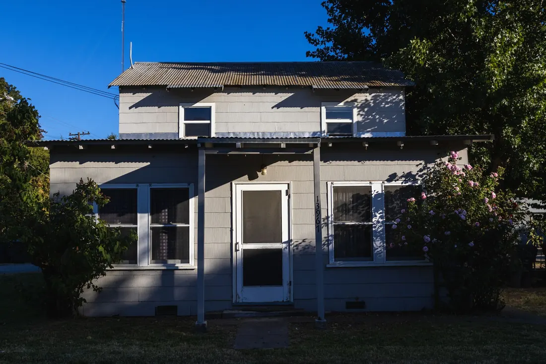 An older Iowa home with a front porch, the kind of house that won't pass FHA when repairs are needed
