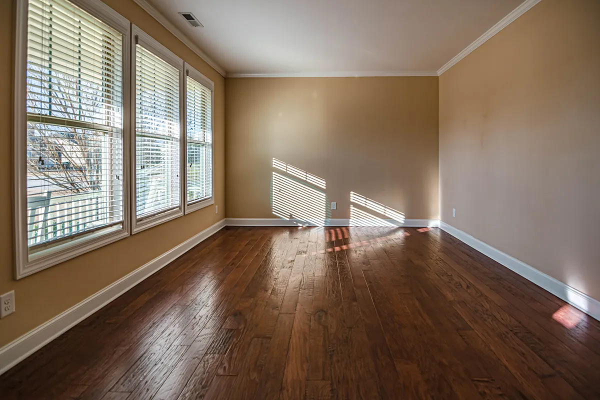 A bright, sunlit empty room that could be lightly staged before selling