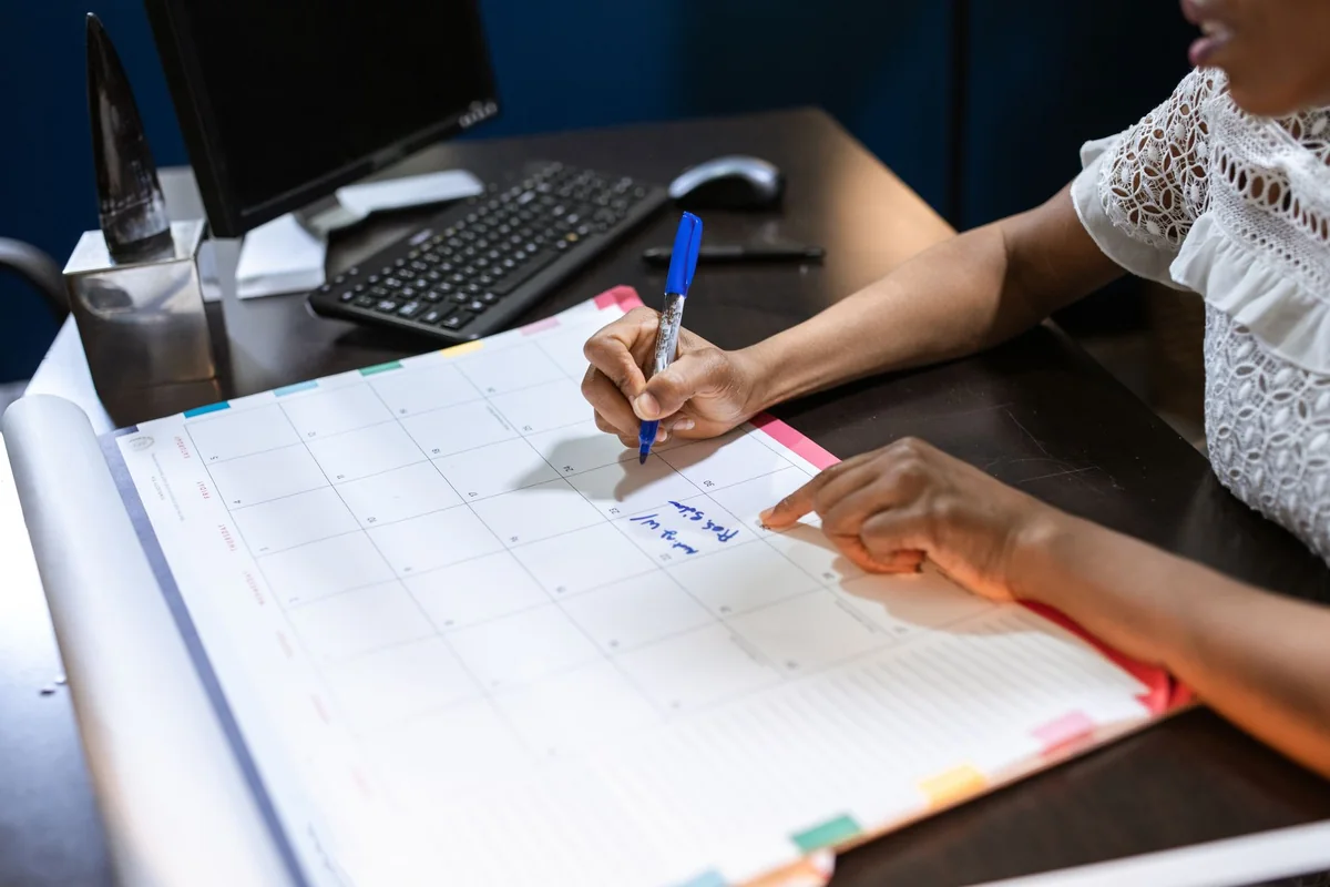 Writing move dates on a calendar to sync two home closings