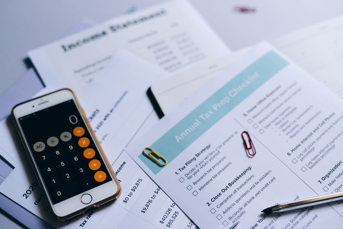 Iowa tax documents and forms on a desk explaining state capital gains rules